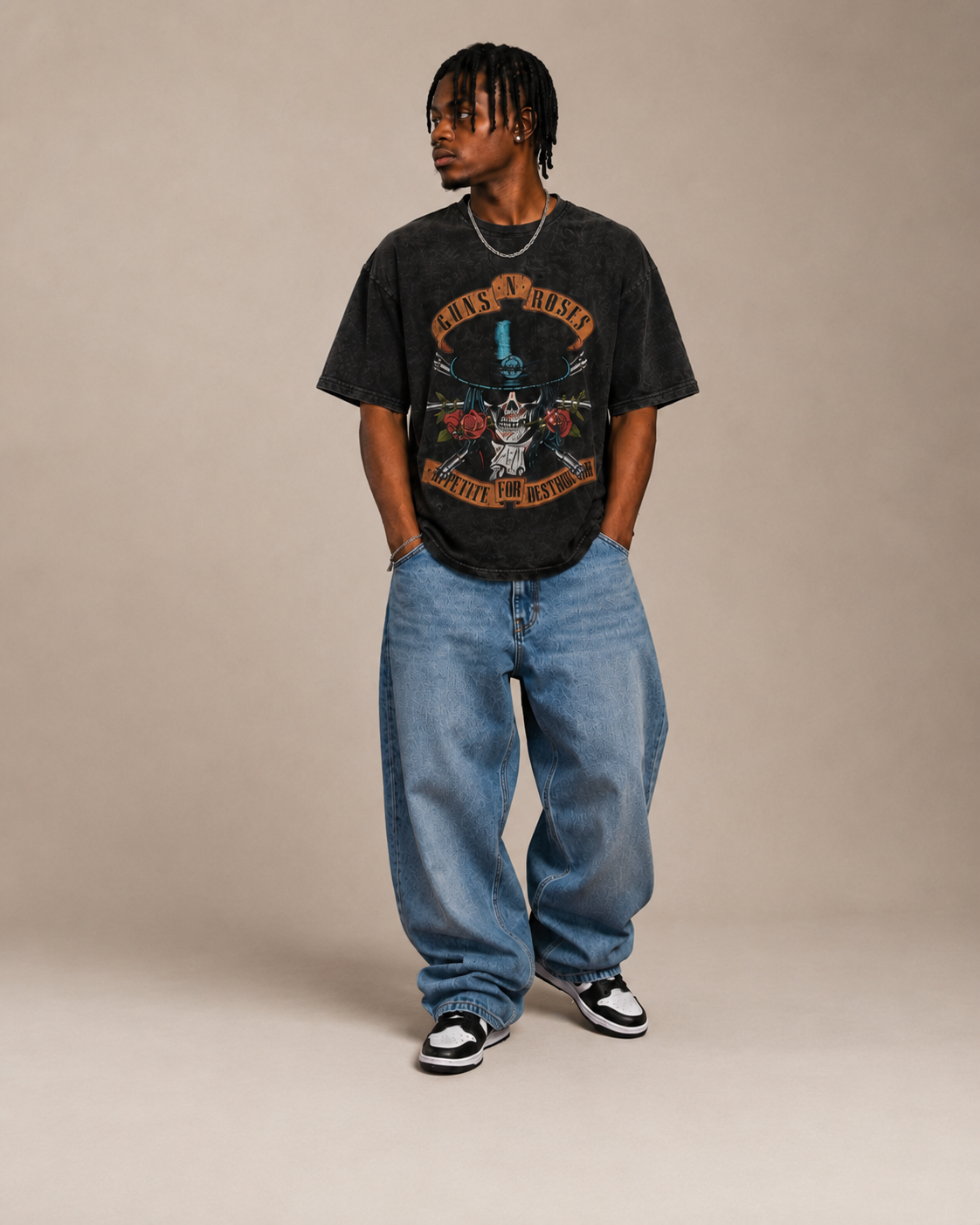 Model wearing a graphic tee, relaxed denim and trainers for Retro in Vogue Streetwear